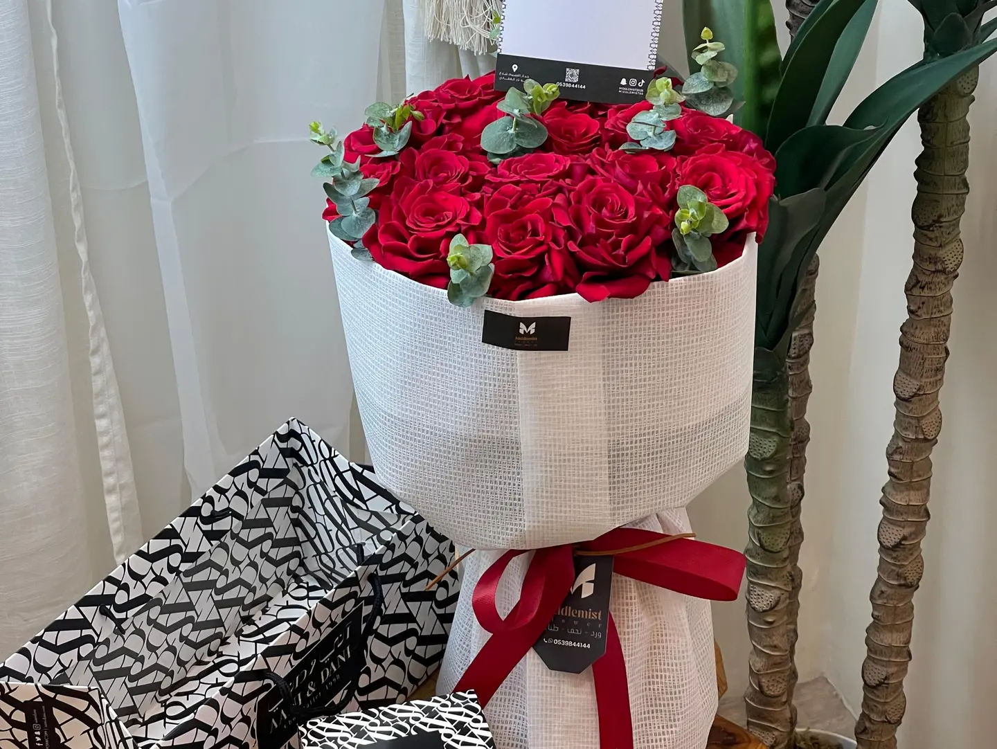 Annie And Danny Chocolates And A Bouquet Of Red Roses