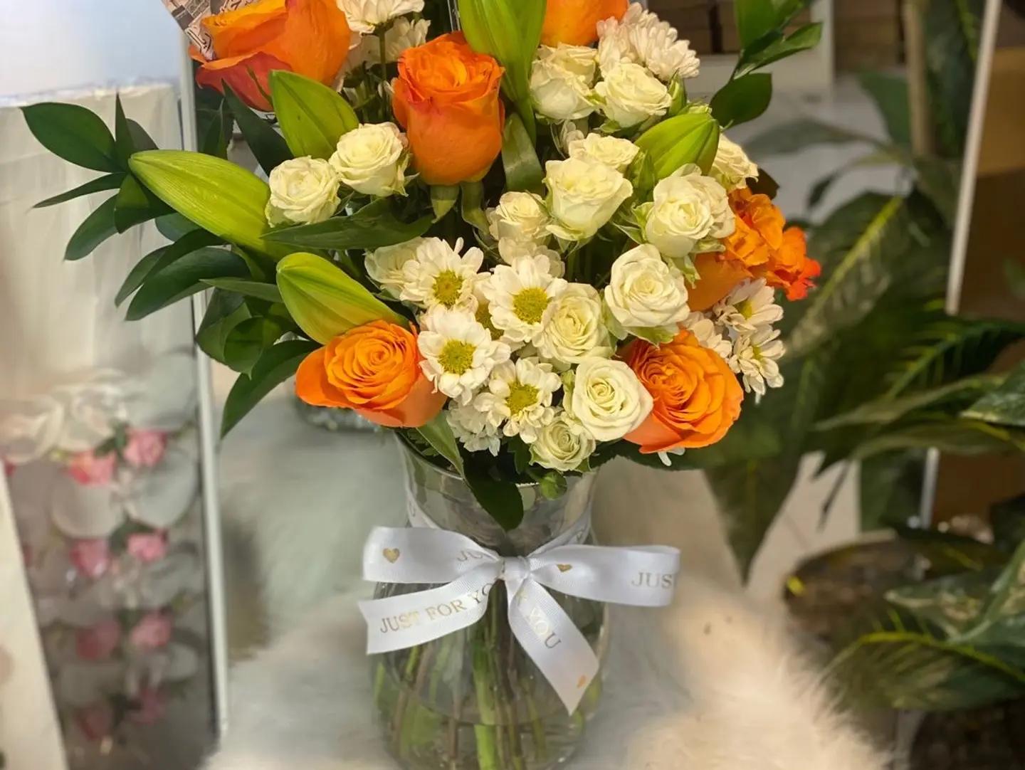 Orange Vase With White Baby Roses