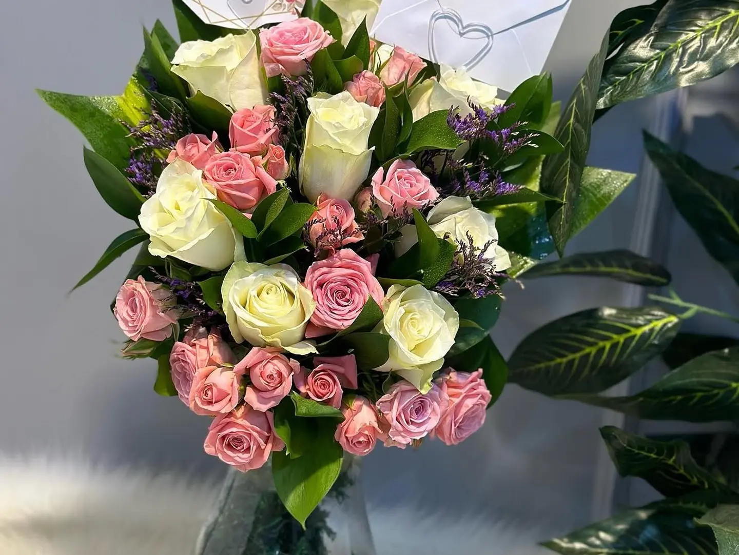 Transparent Pink And White Vase With Green Grass