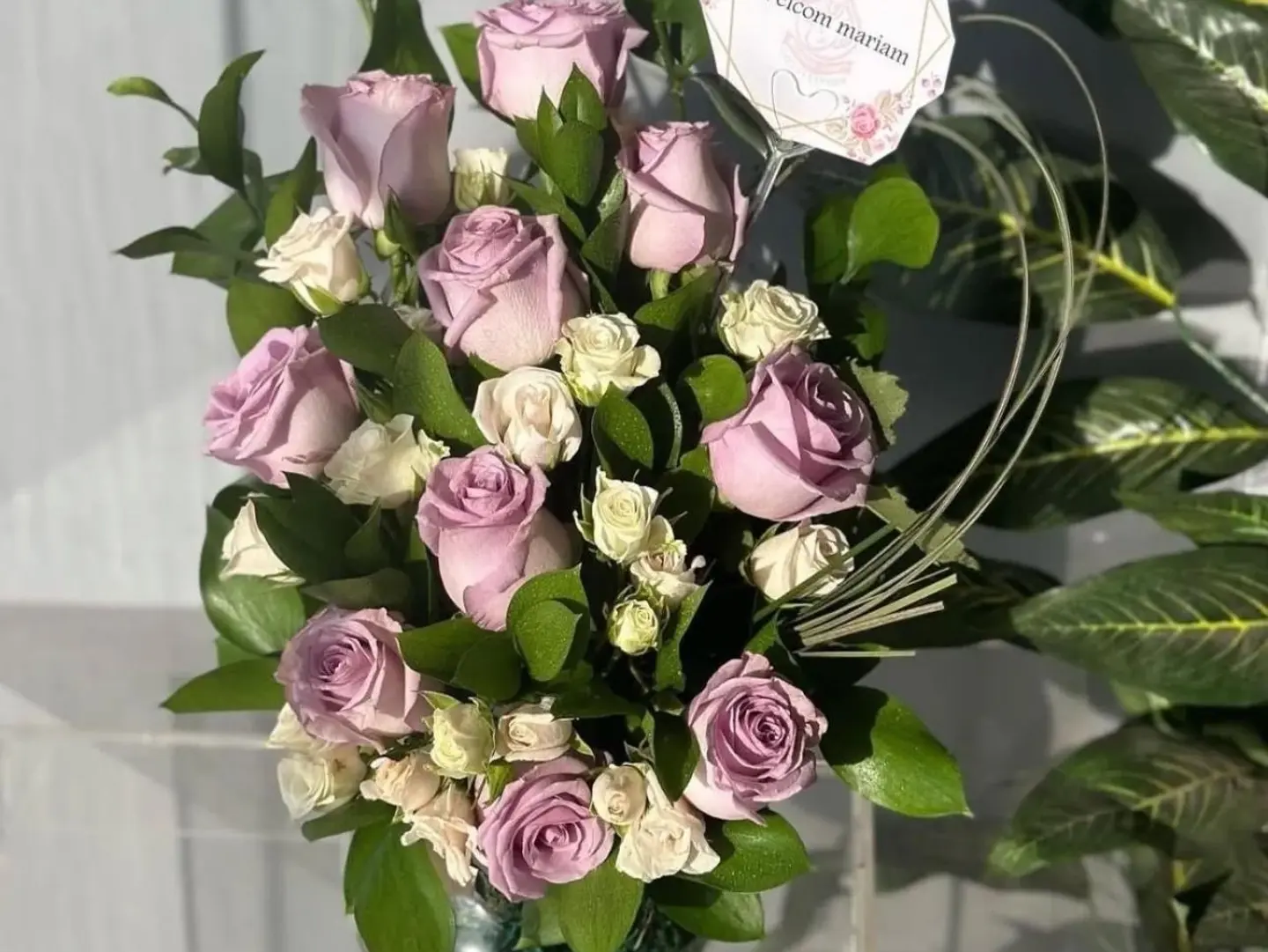 Round Vase With Purple And White Flowers