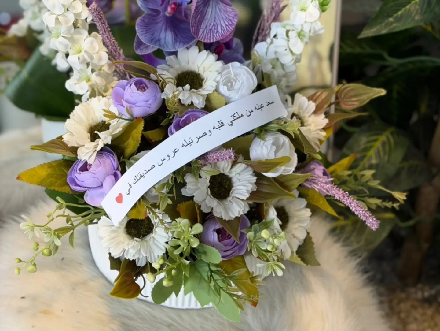 Small Vase Of Purple Shaded Flowers