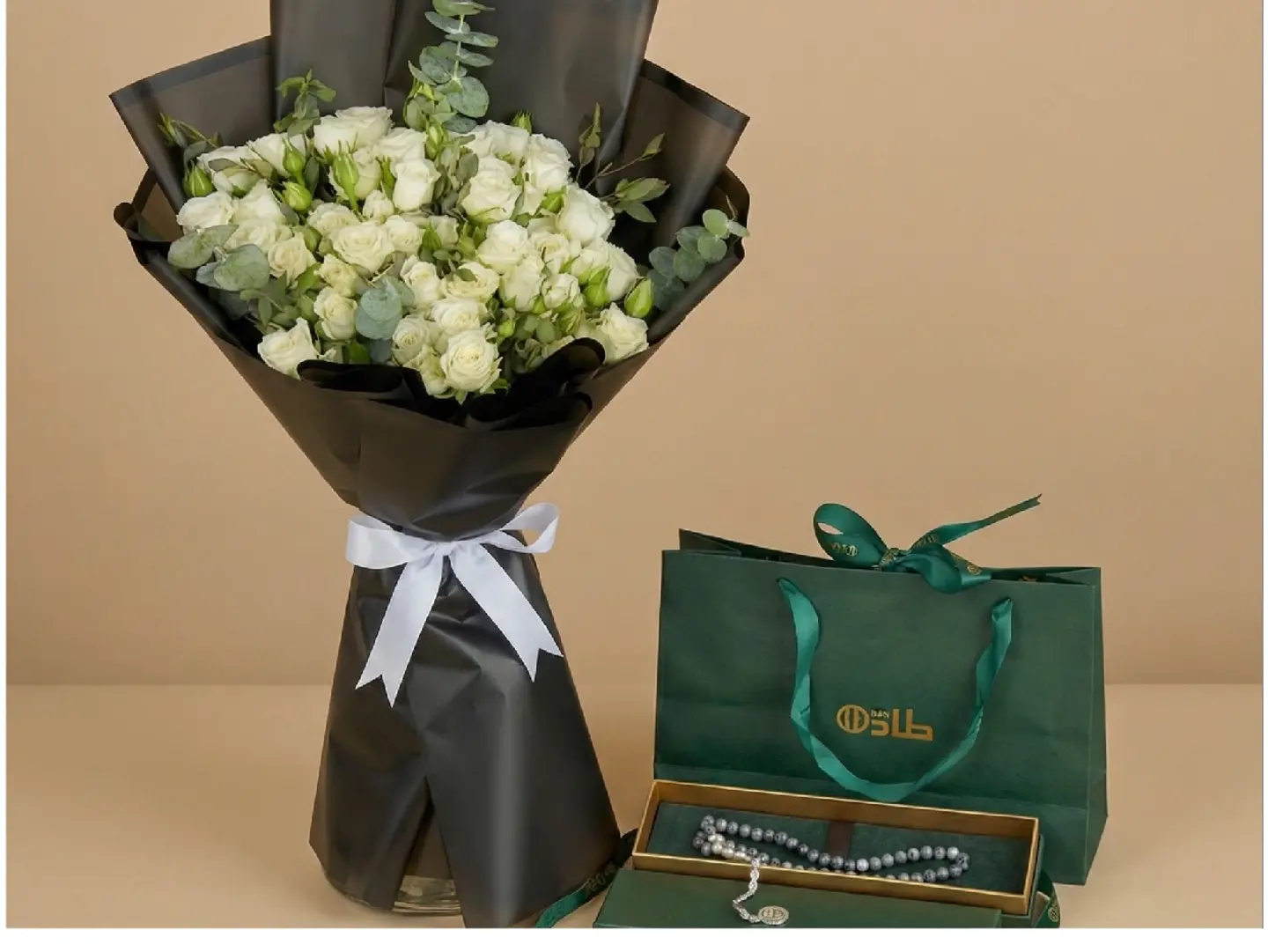 A Bouquet Of White Roses With A Rosary