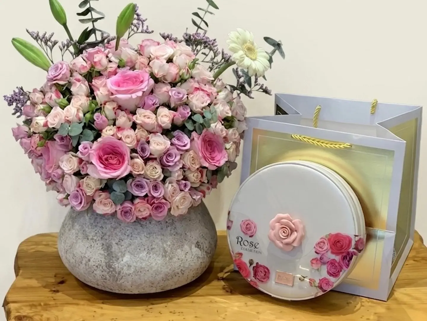 A Vase Of Roses With A Gardener's Design