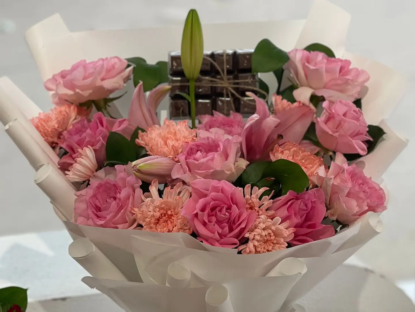 A Bouquet Of Roses With Chocolates