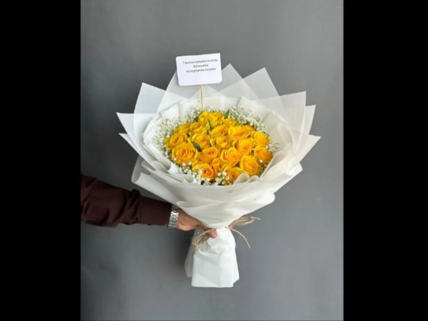 Thank God For Your Safe Return. A Bouquet Of Yellow Roses With White Packaging.