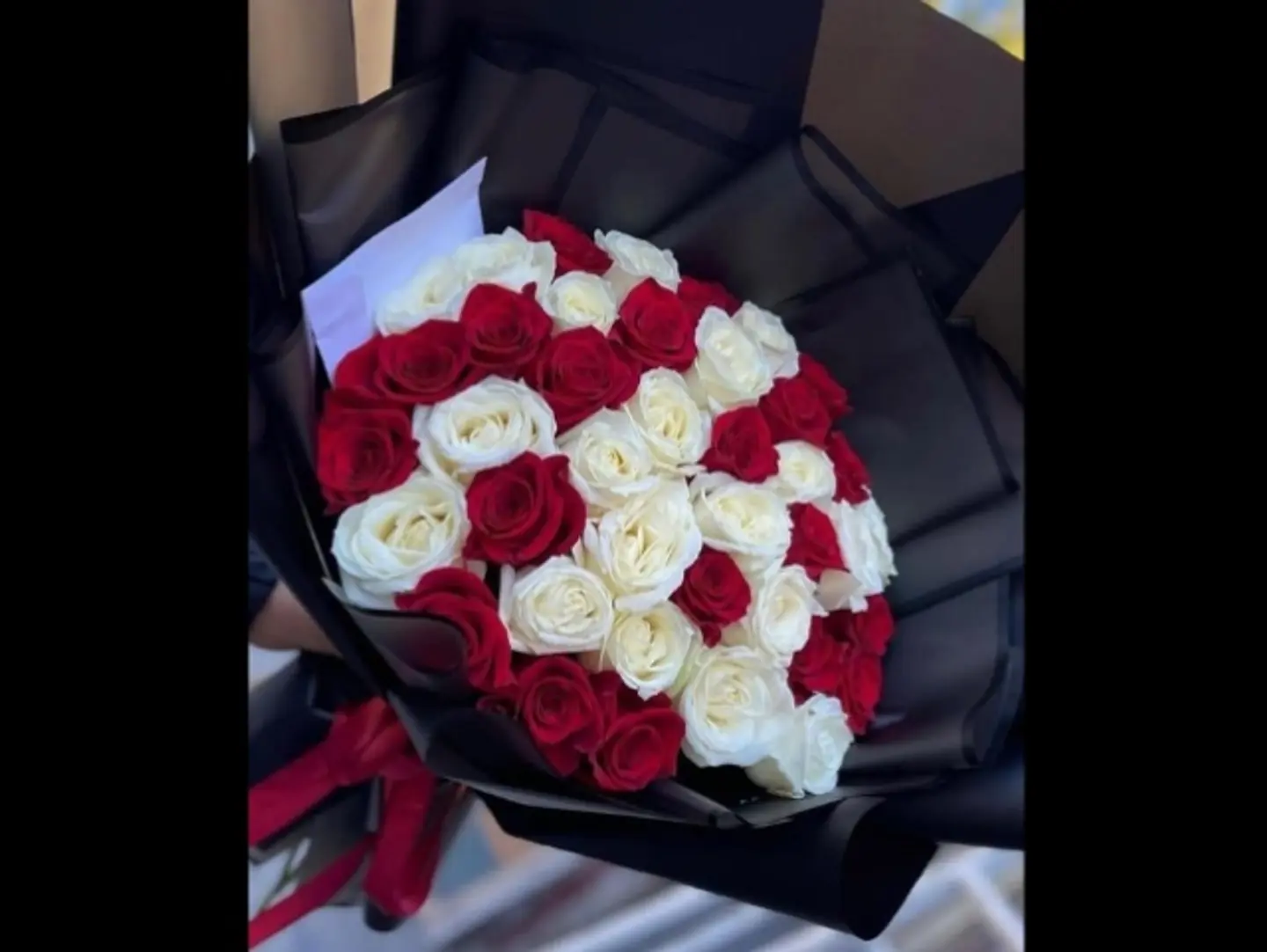 A Bouquet Of 30 White And Red Roses, Black Packaging.