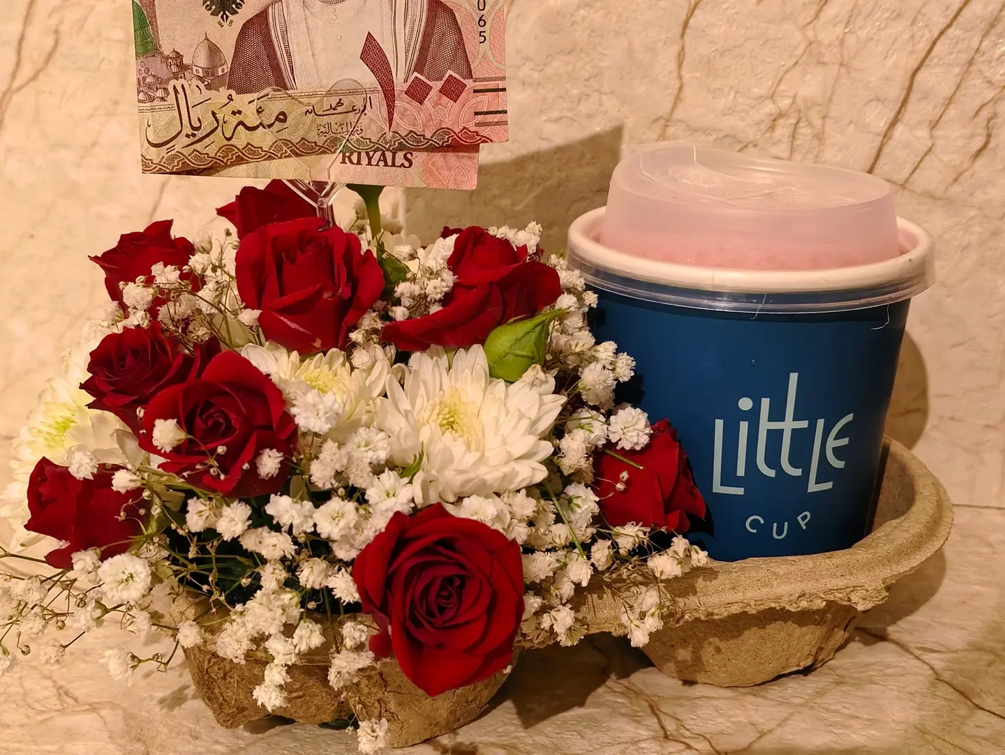 A Coffee Or Hibiscus Drink From Little Cup With Rose