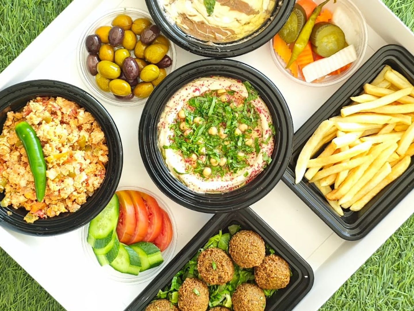 Oriental Breakfast Box: Fava Beans, Hummus, Shakshouka, Falafel, Potatoes, And Olives