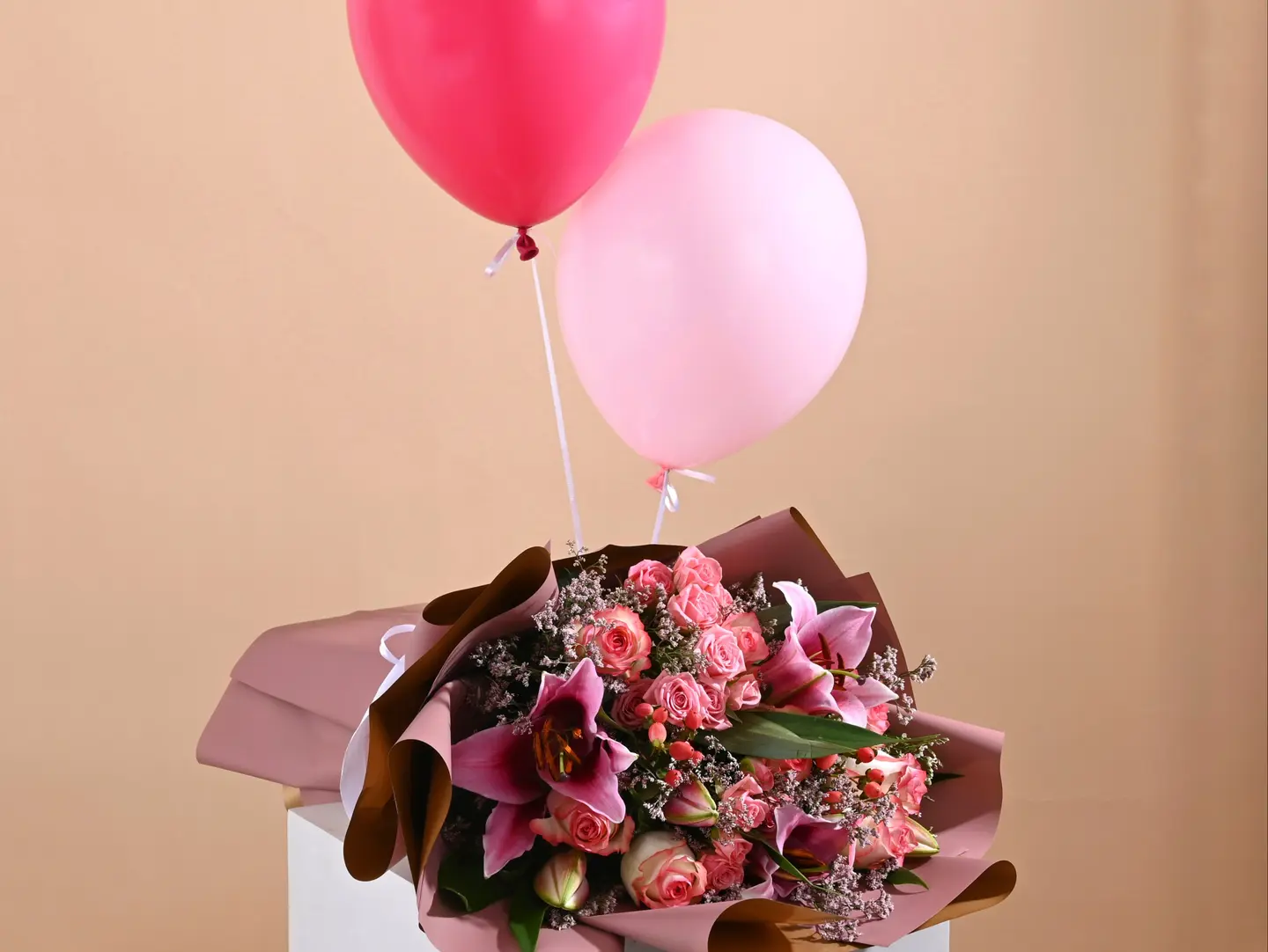 A Set Of Roses And A Balloon For The Newborn