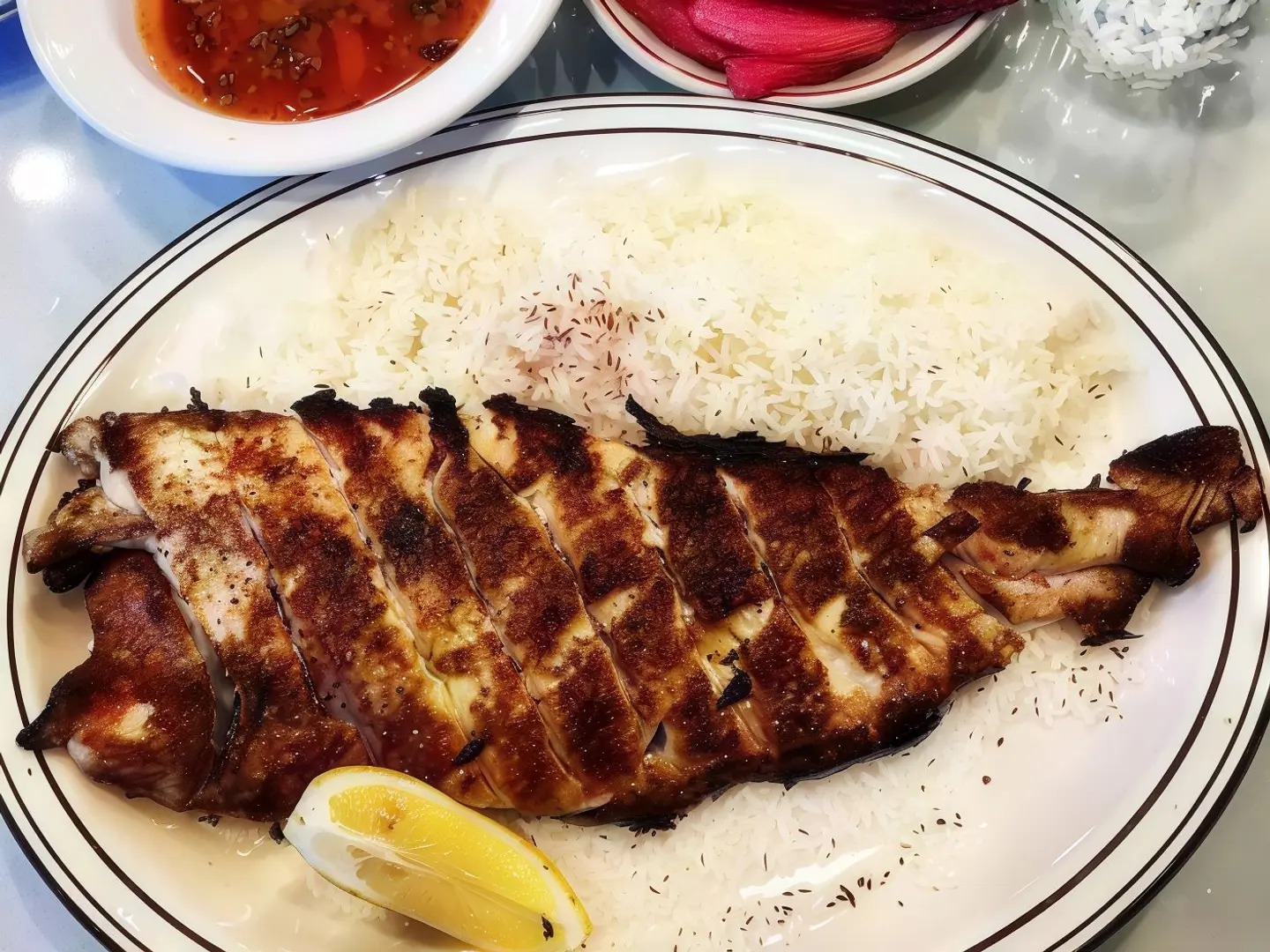 سمك دنيس طازج مشوي مع أرز