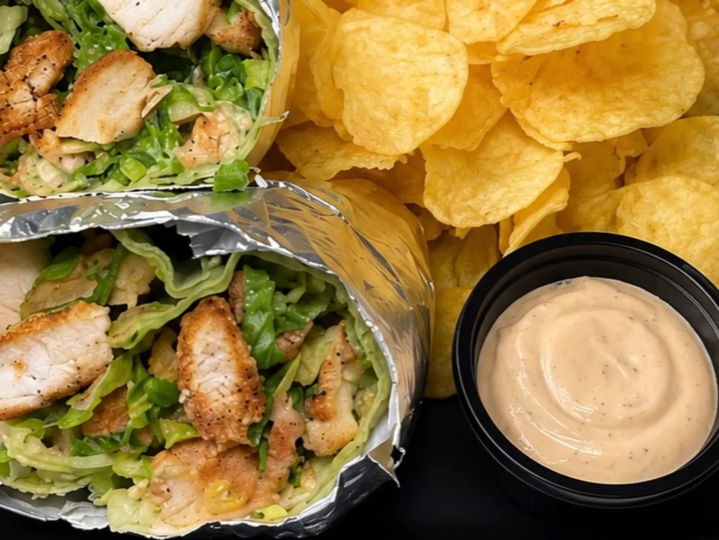 Chicken Caesar Wrap With Chips And Sauce