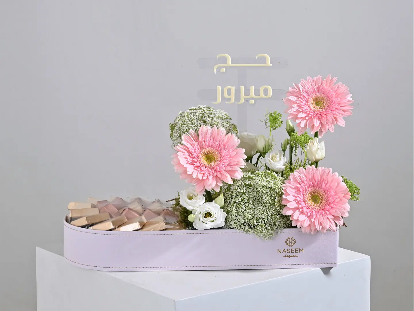 Pink Floral Arrangement With Chocolate