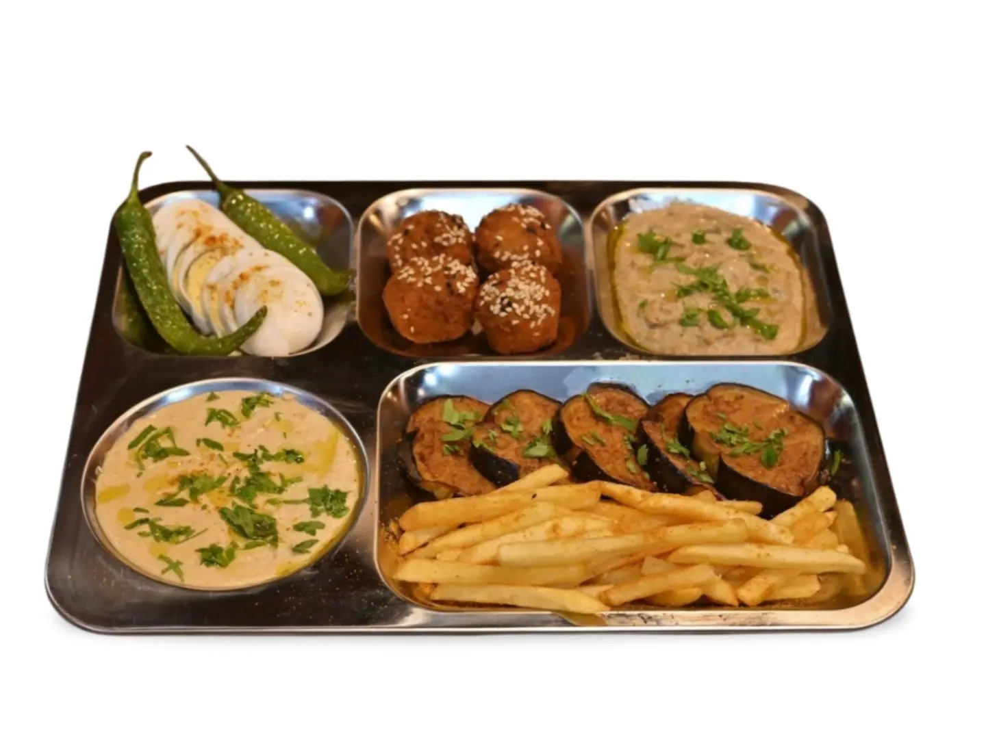 A Plate Of Falafel With Sauces, Potatoes, And Bread