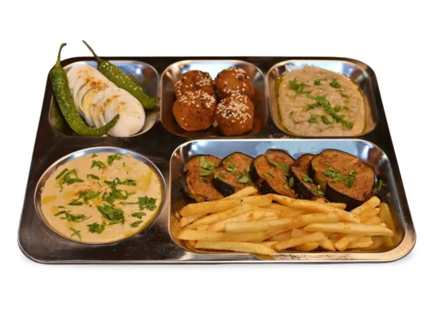 A Plate Of Falafel With Eggs, Sauces, And Bread.