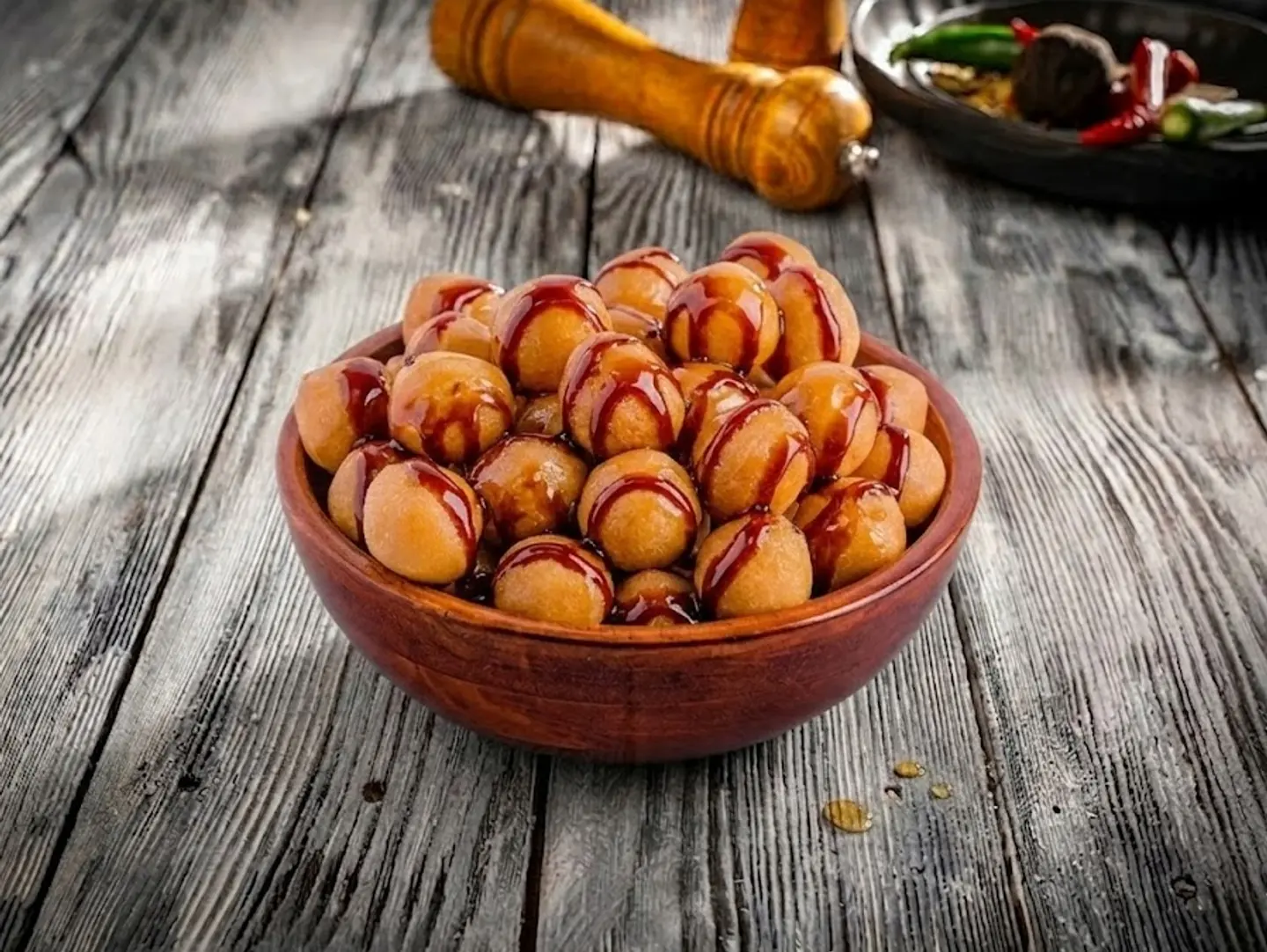 Luqaimat Balls With Wheat Sprinkled With Date Molasses