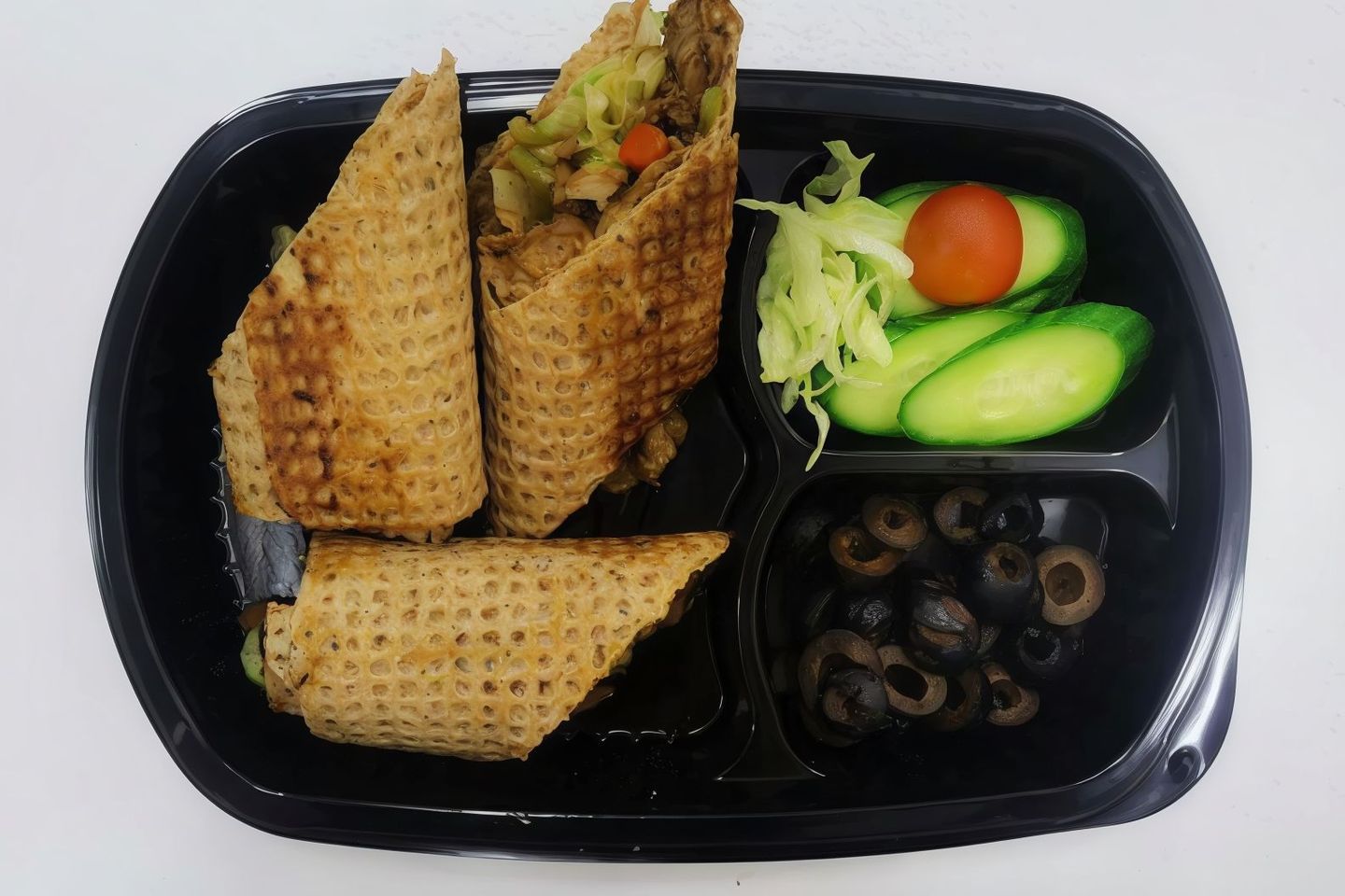 Meat Shawarma Sandwich With Cucumber, Brown Olives And Lettuce