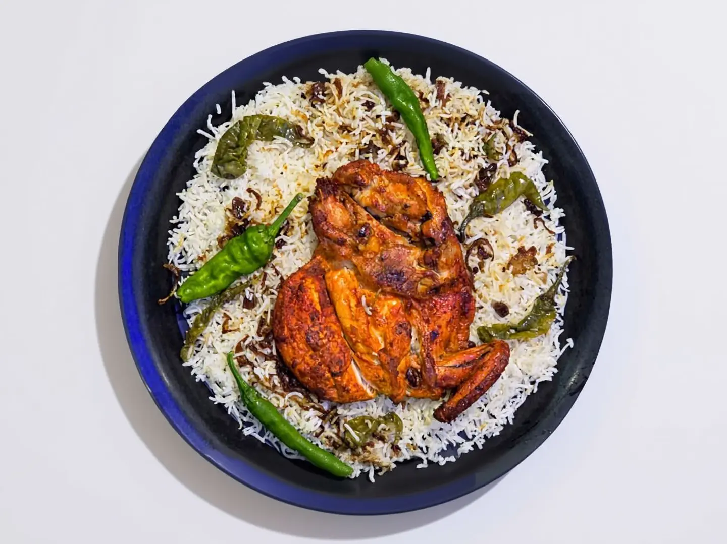 نصف حبة دجاج مظبي حار مع أرز بشاور