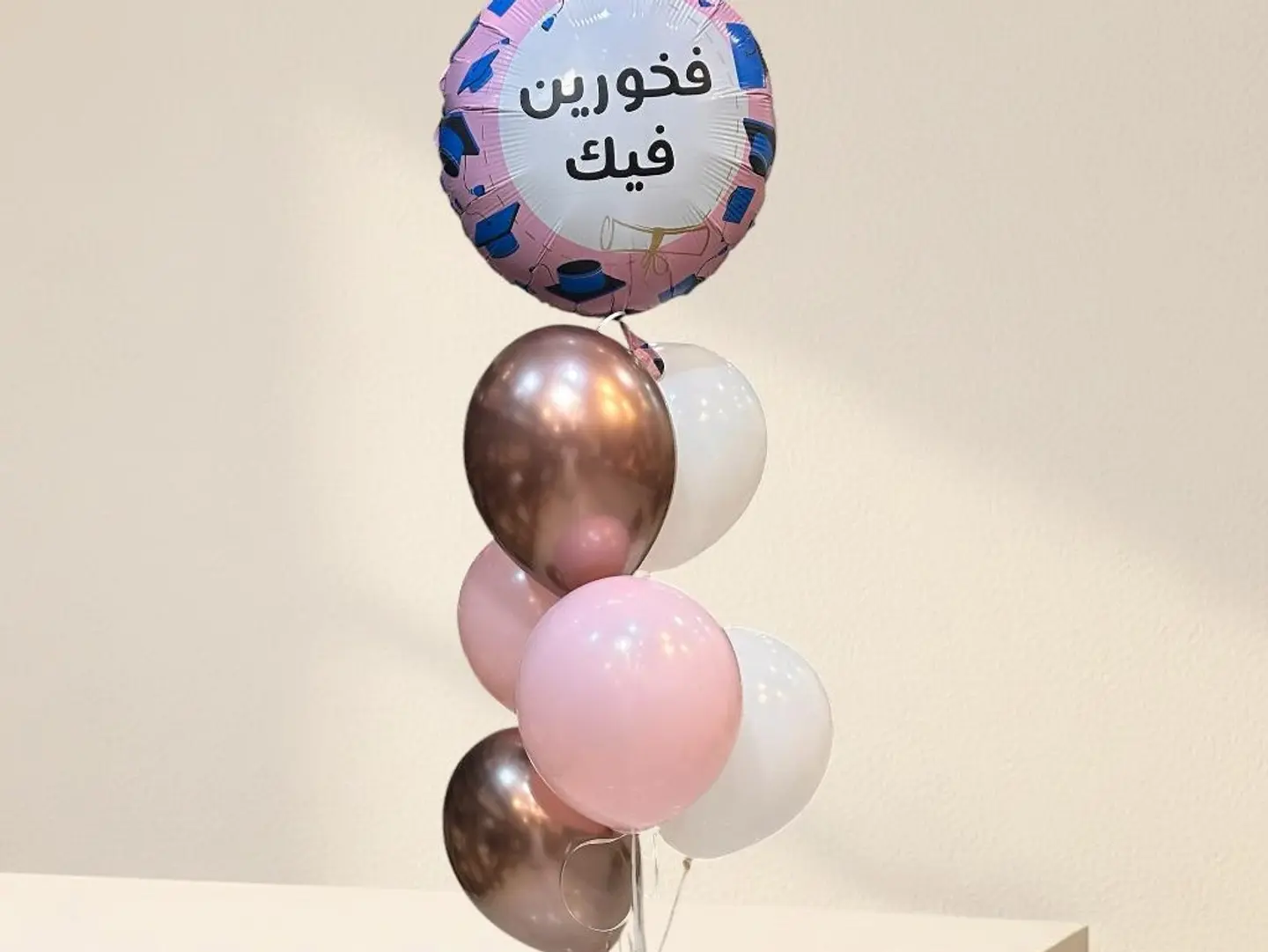 A Stand Containing 7 Helium Balloons