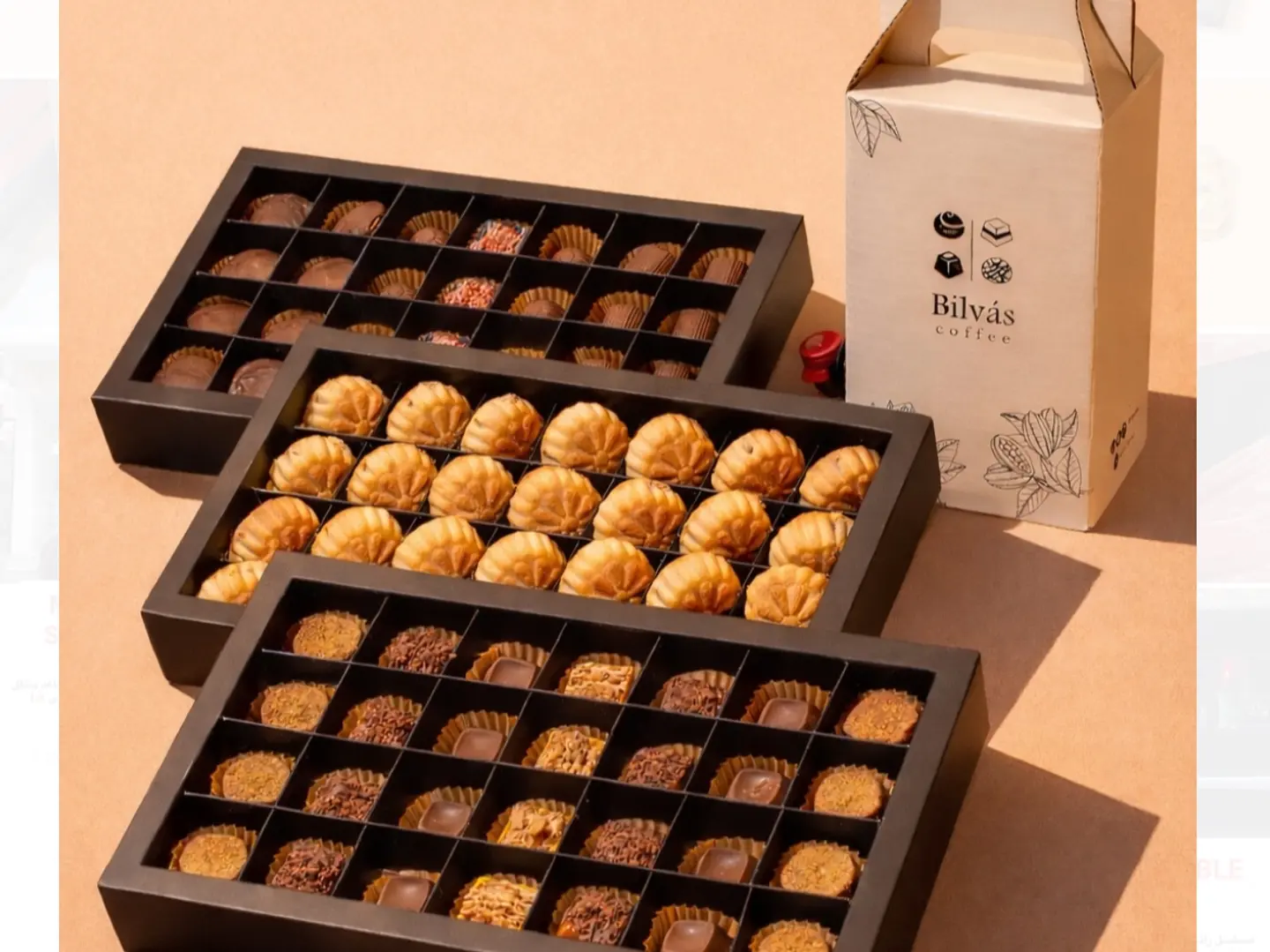 3 بكسات شوكولاته ومعمول بالاضافة إلى بكس قهوة سوداء