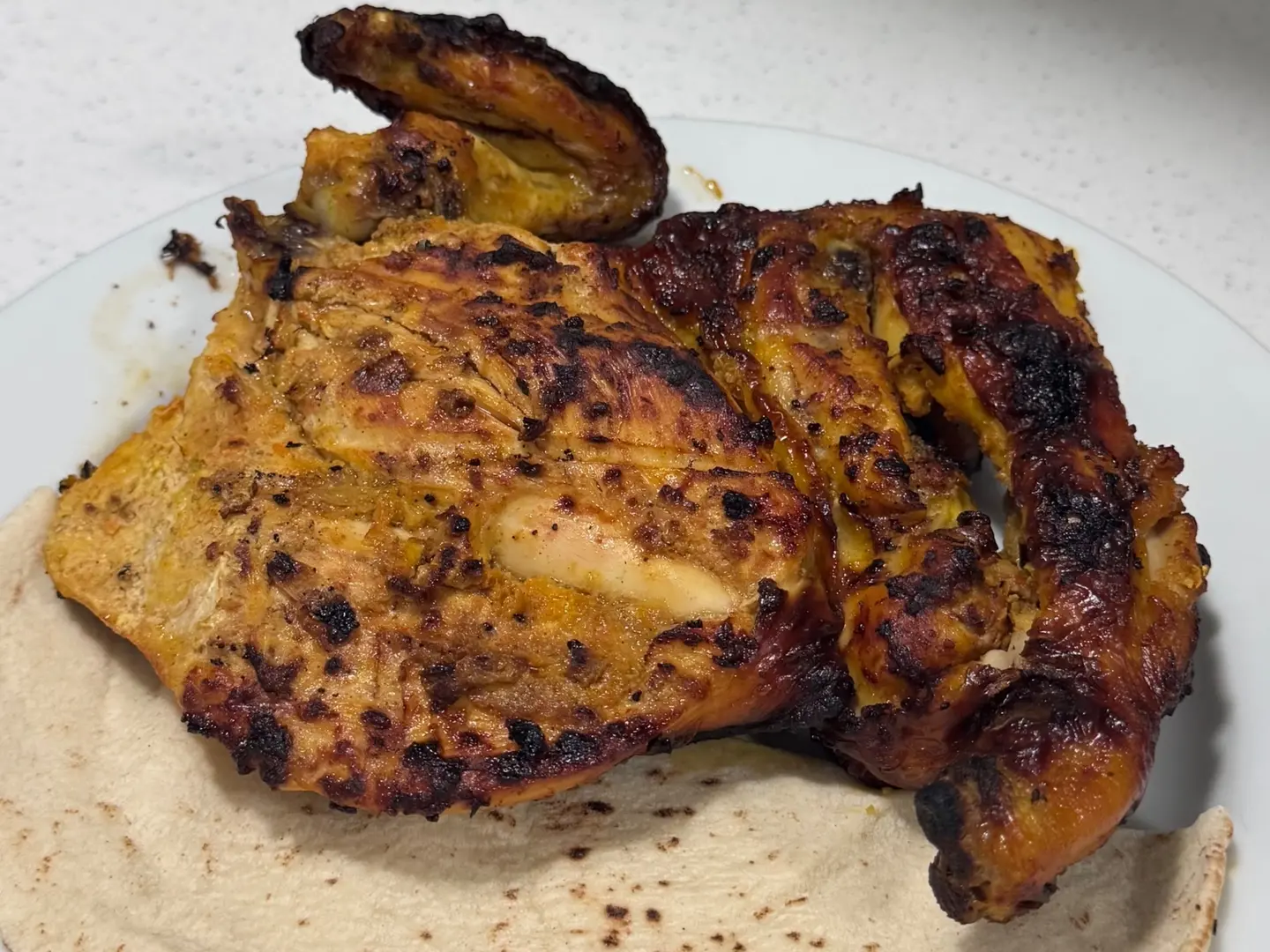 نصف دجاجة على الفحم