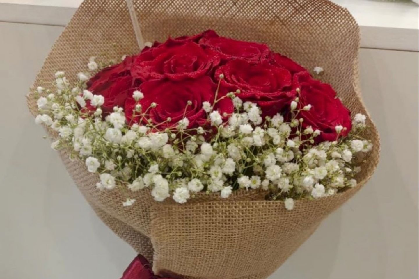 Hand Bouquet Red Roses With Brown Wrap