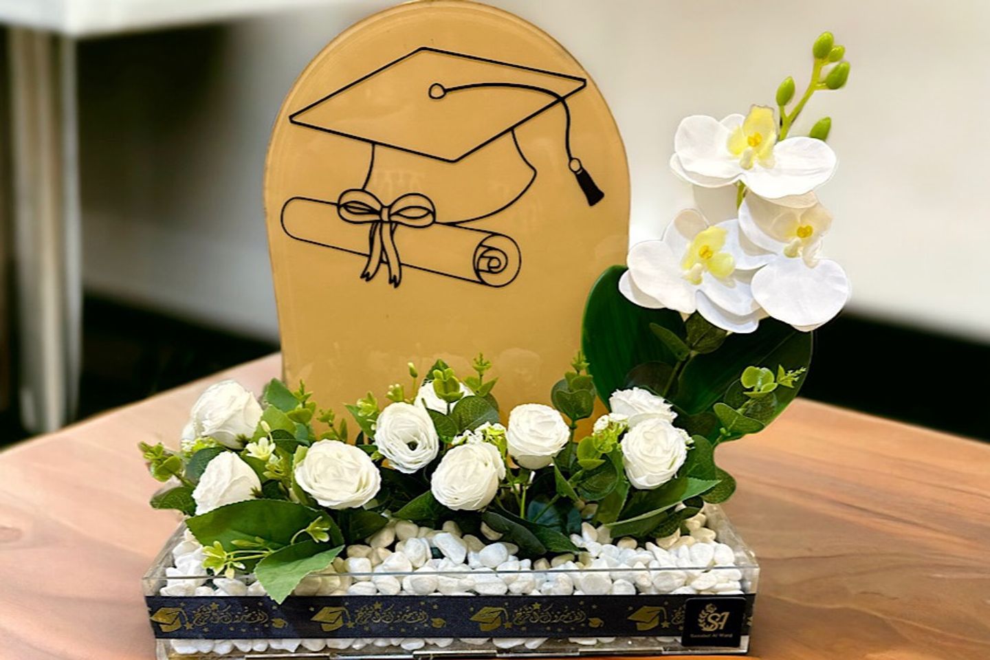 Graduation Stand With White Artificial Flowers