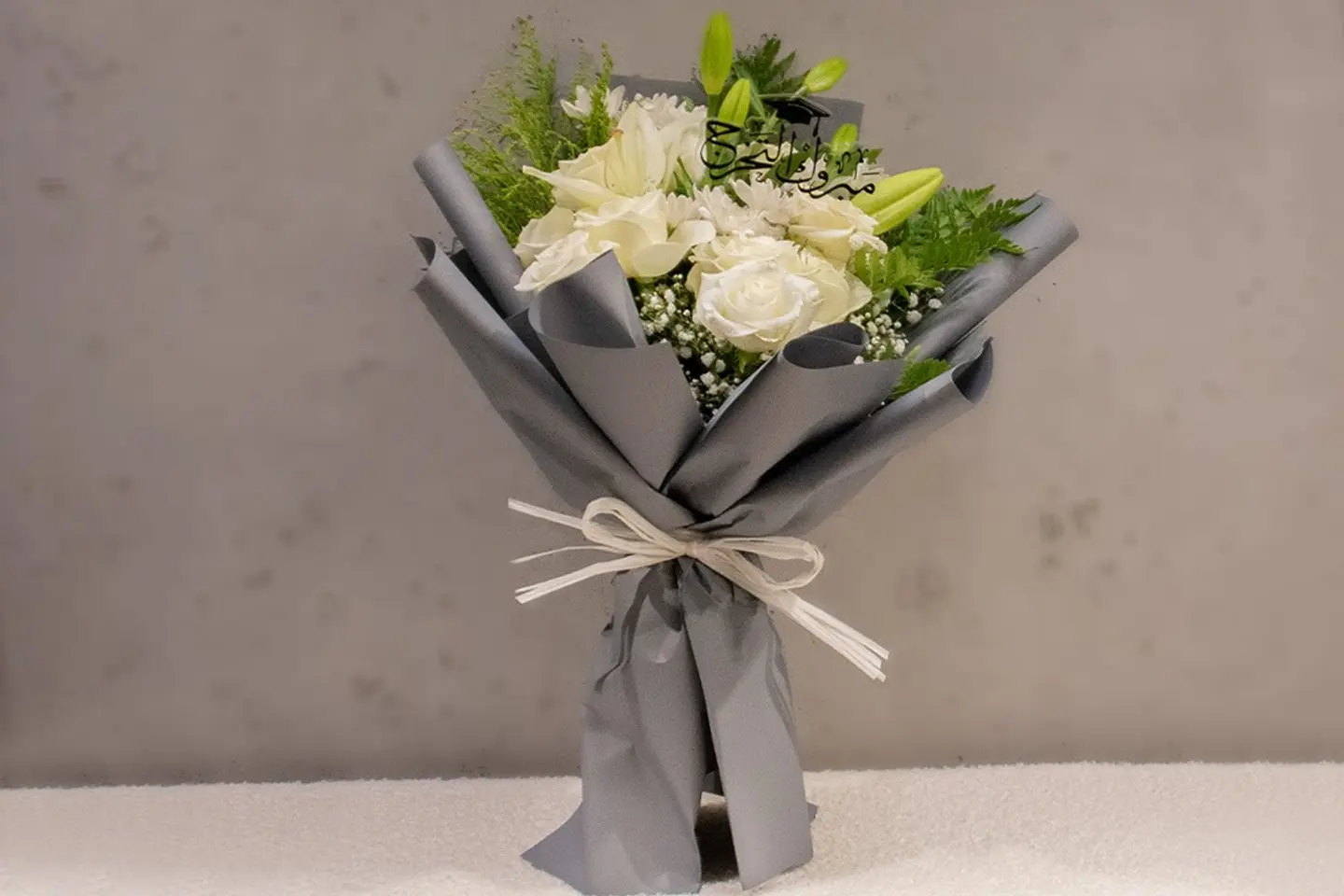 A Bouquet Of White Roses With A Congratulations On Graduation