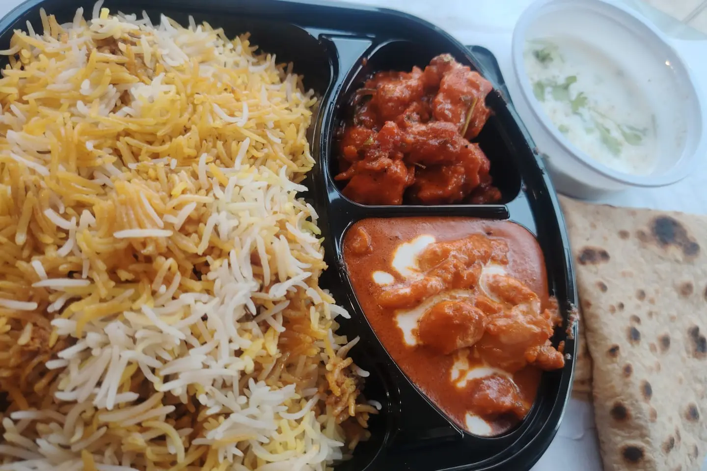 Biryani Rice Butter Chicken Gobi Manchho Roti Raita