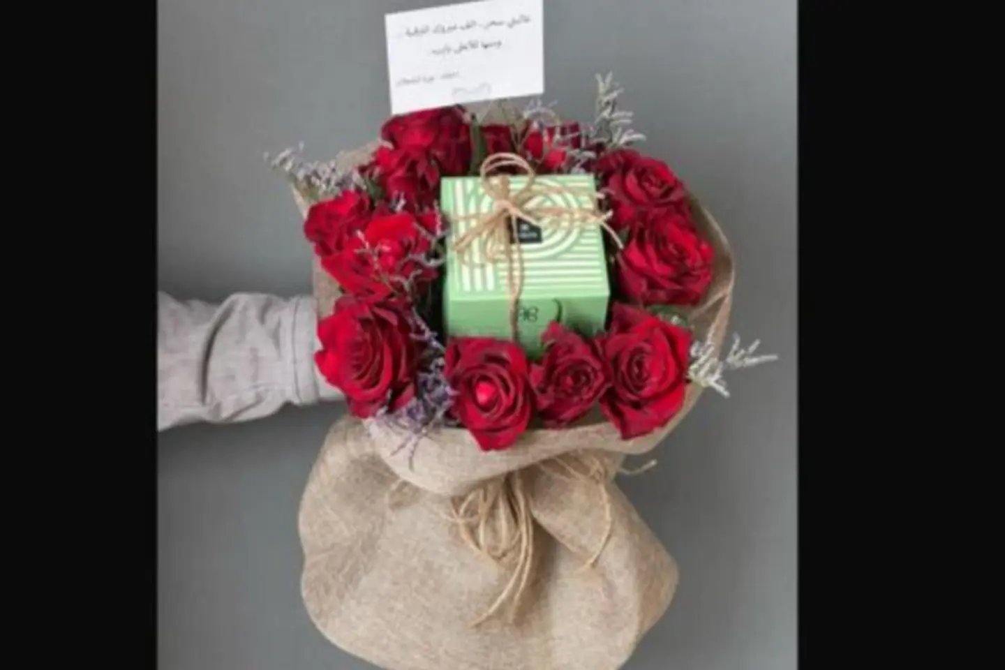 A Quarter Of A Patchi With Red Roses In A Burlap Cover