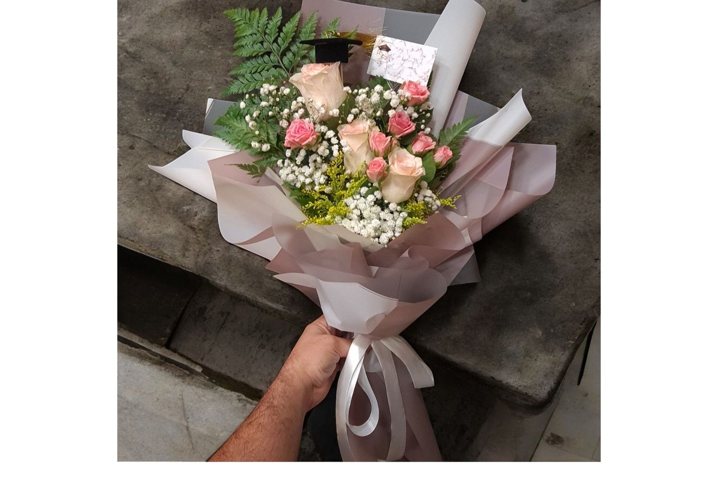 A Bouquet Of Roses And Gypsophila