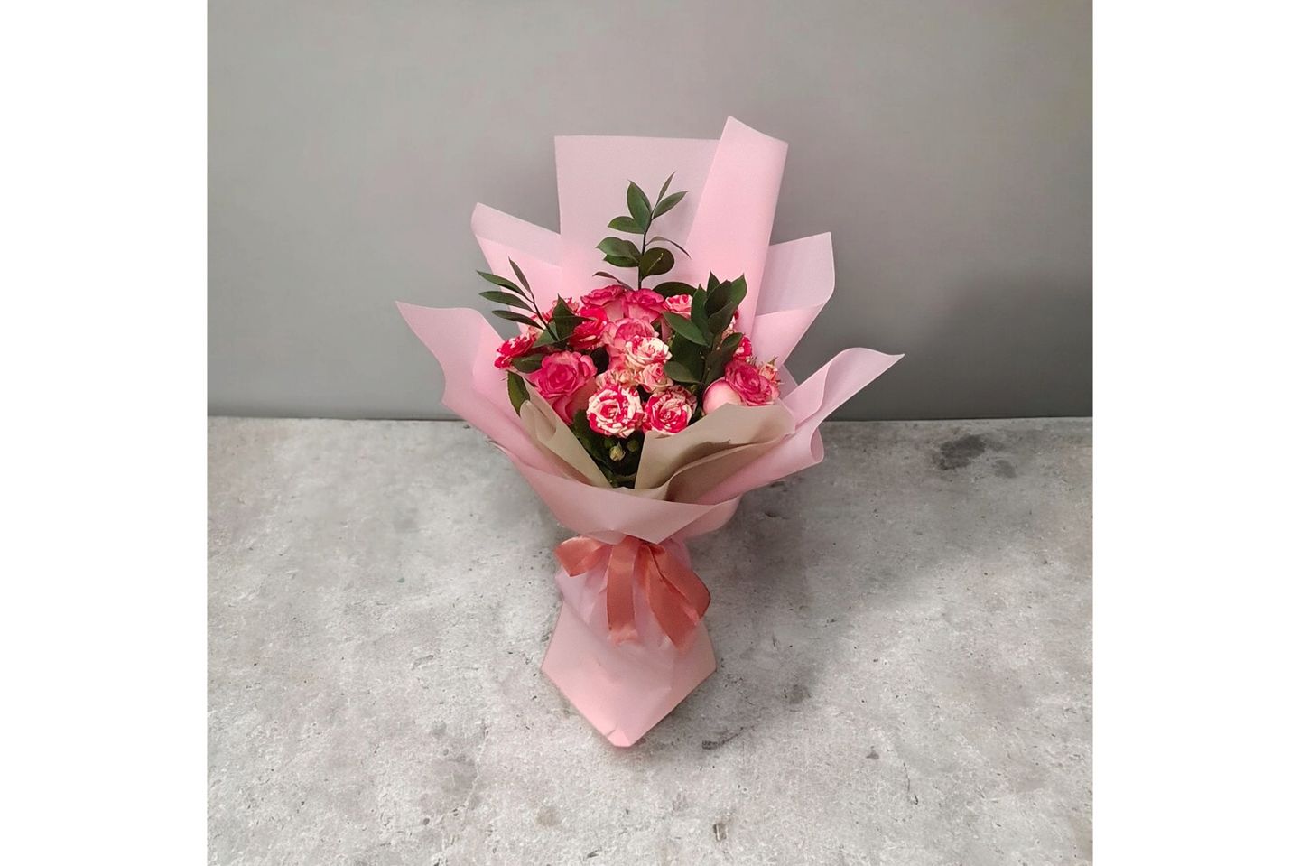 A Bouquet Of Roses And Baby Roses