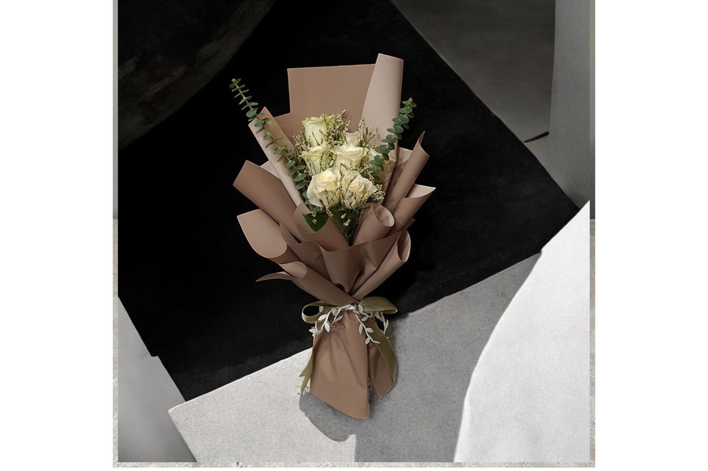A Bouquet Of White Roses And Colobus
