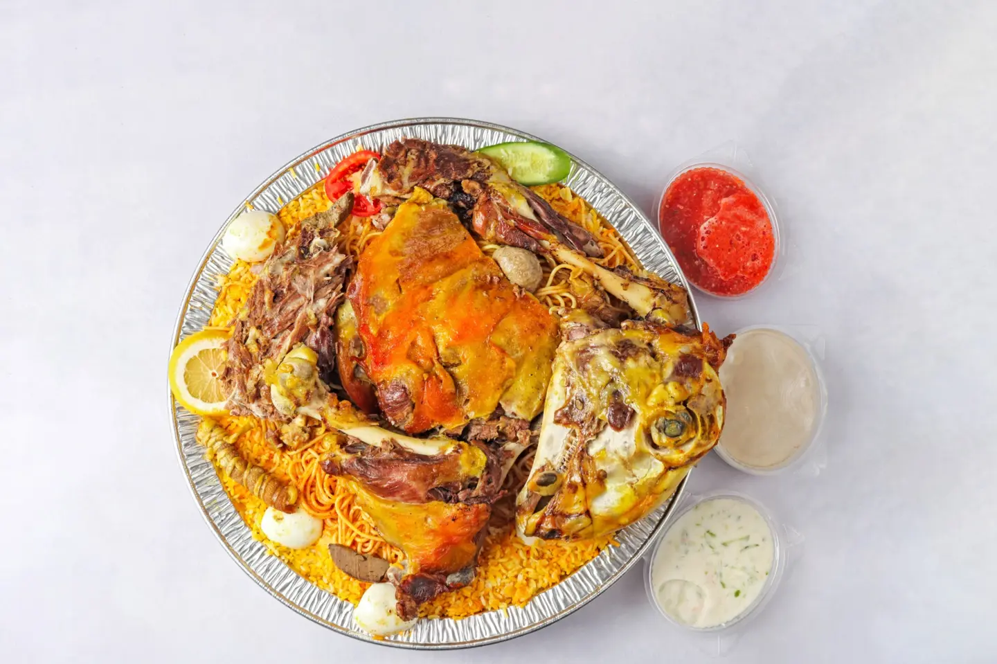 ربع ذبيحه حنيذ بالمرخ مع رز الحنيذ