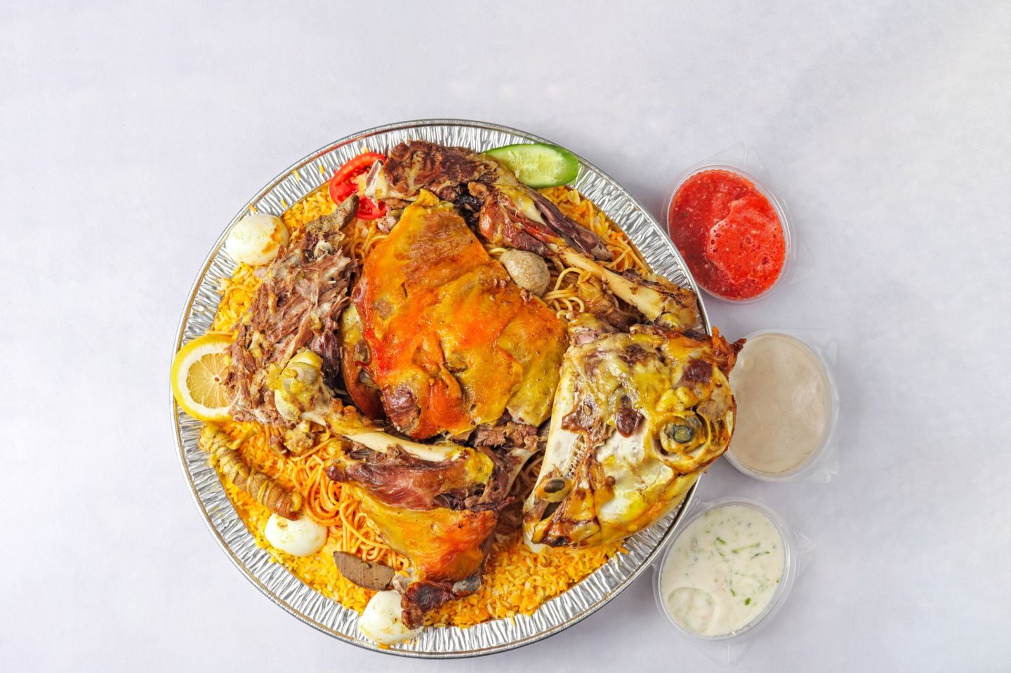 ربع ذبيحه حنيذ بالمرخ مع رز الحنيذ