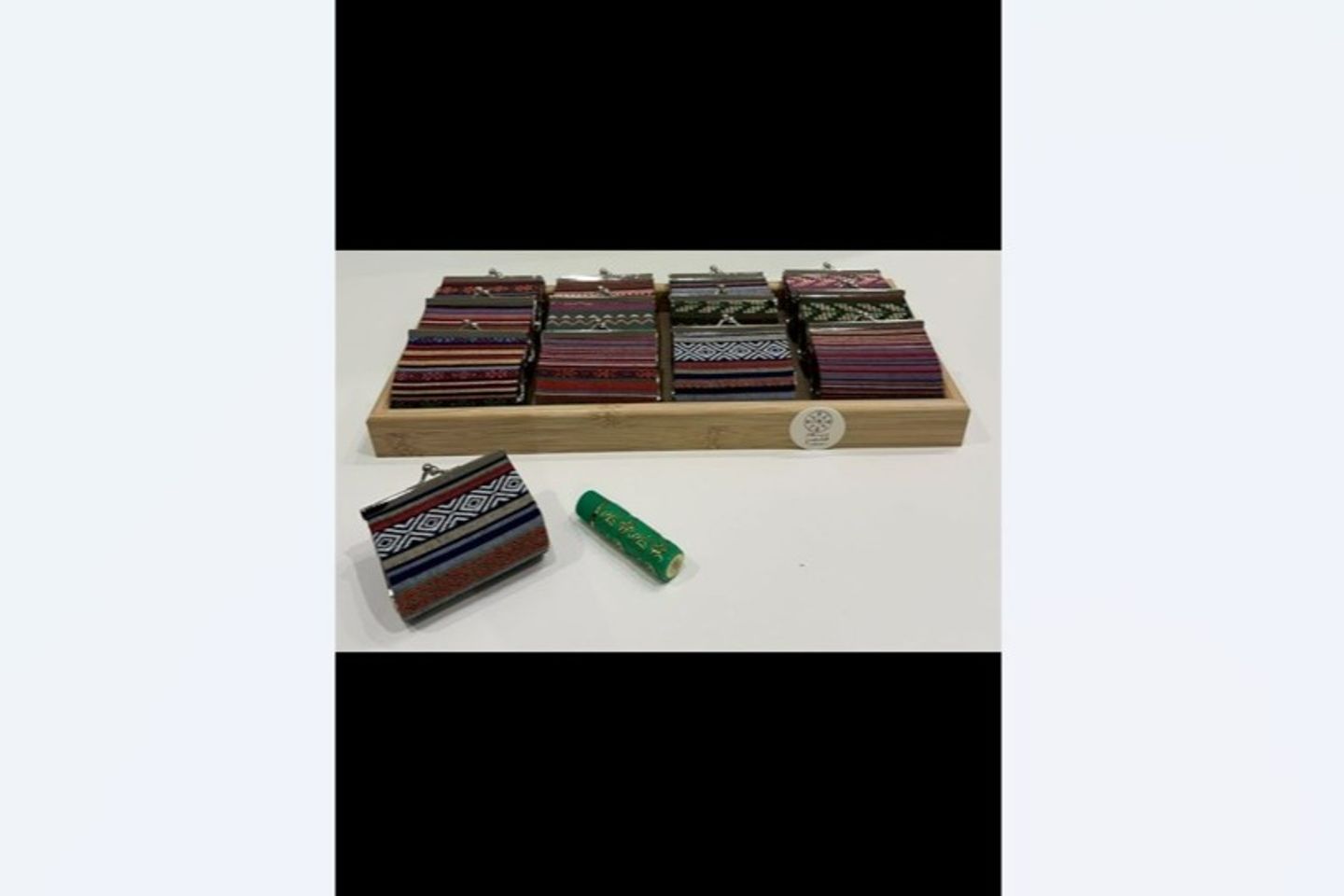 Distribution Tray Filled With A Bag And Lipstick