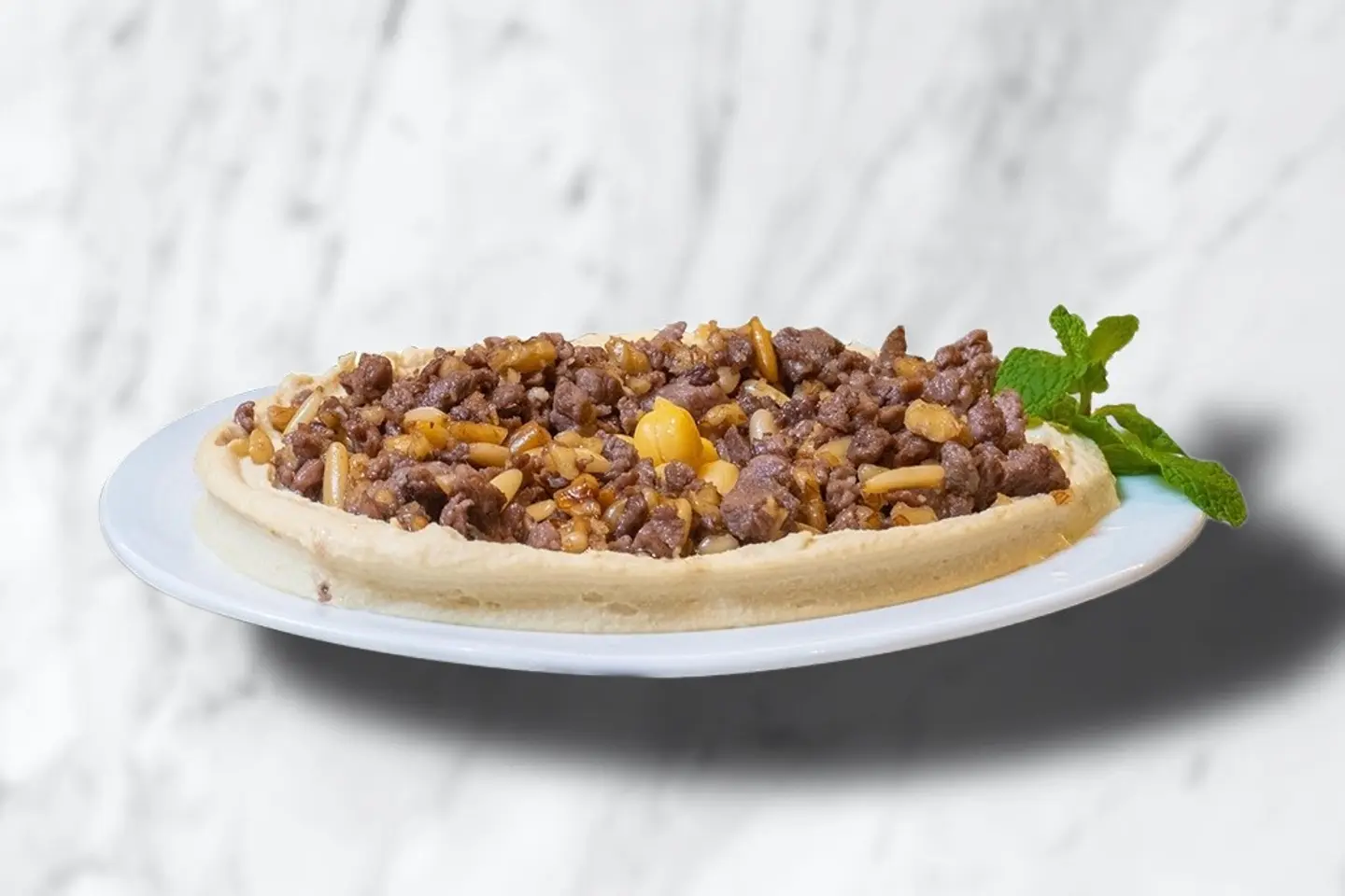 حمص باللحمة و المكسرات