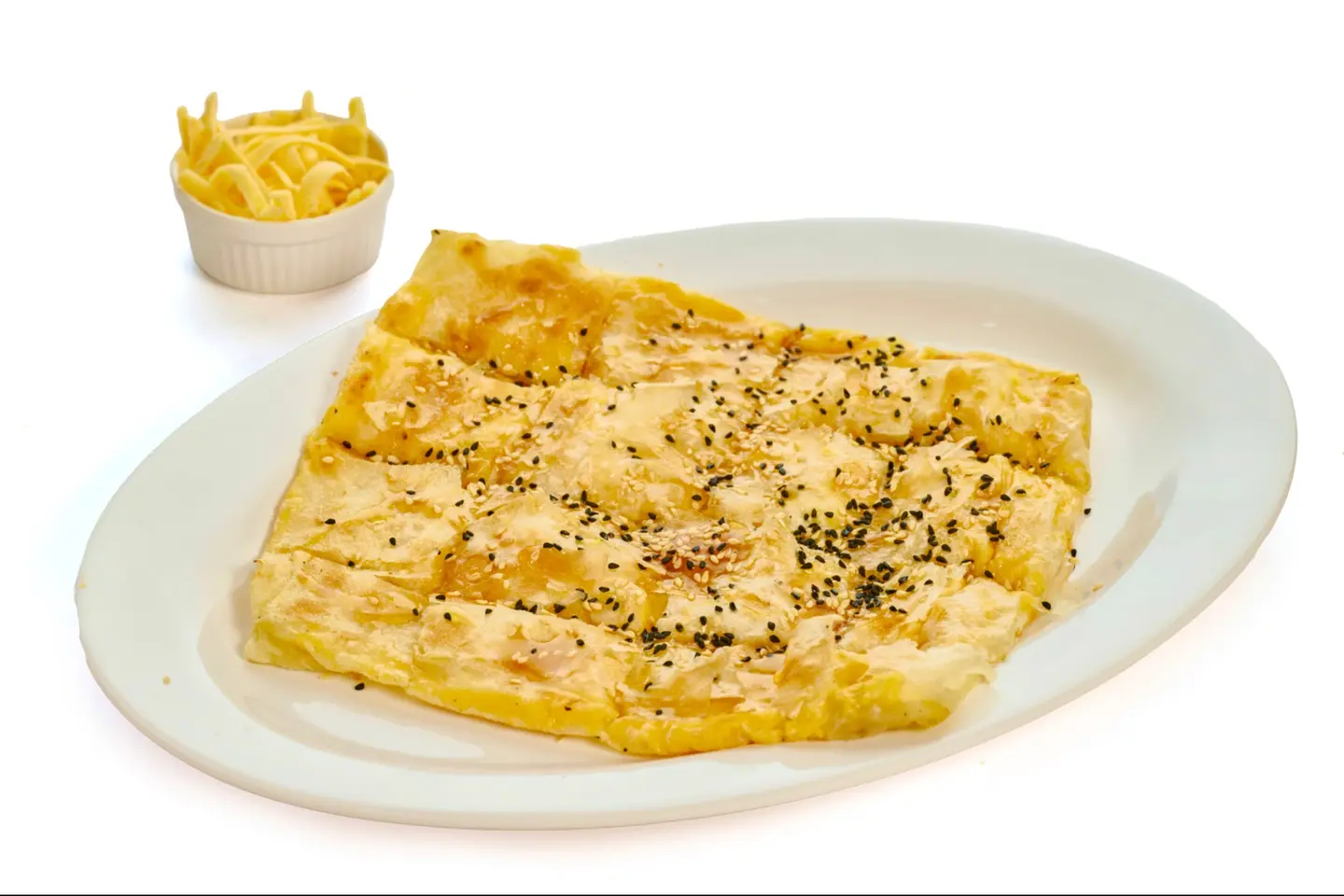Cheddar Cheese Mutabbak With Honey, Sesame And Black Seed
