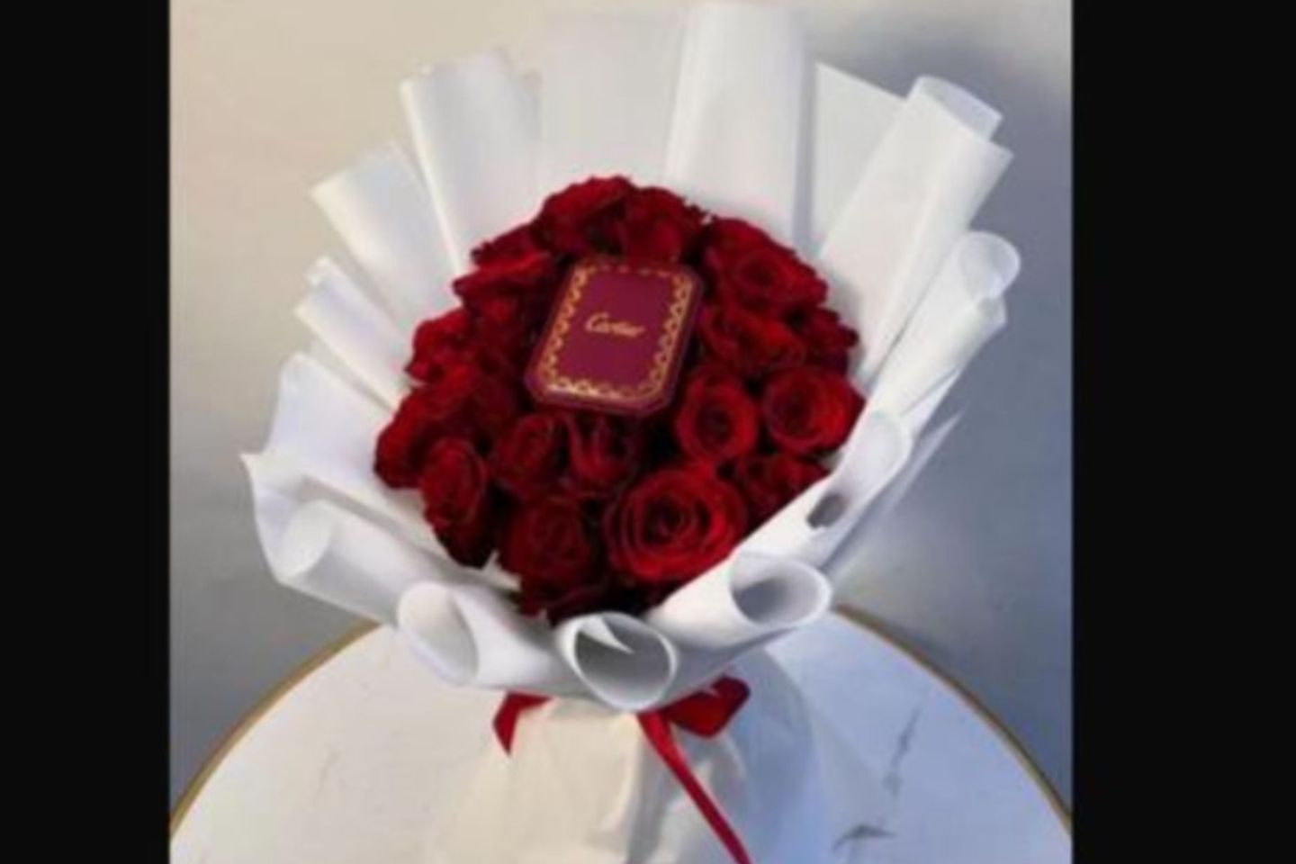 Cartier Brand Chain In The Middle Of A Bouquet Of Red Roses White Cover