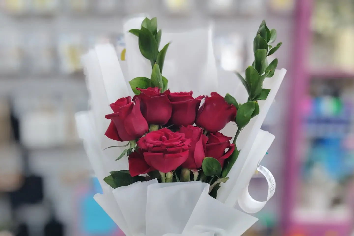 A Bouquet Of 7 Red Roses, White Packaging