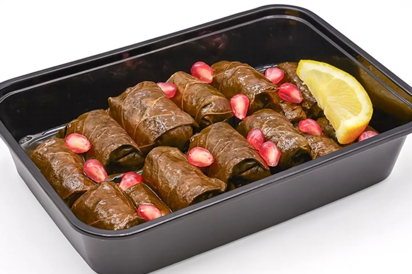 12pieces Of Sweet And Sour Stuffed Grape Leaves Filled With A Special Mix Of Rice Vegetables Lemon Juice And Pomegranate Seeds