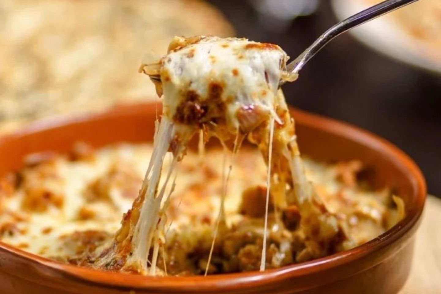 Chicke Claypot With Melted Mozzarella Cheese And Potatoes