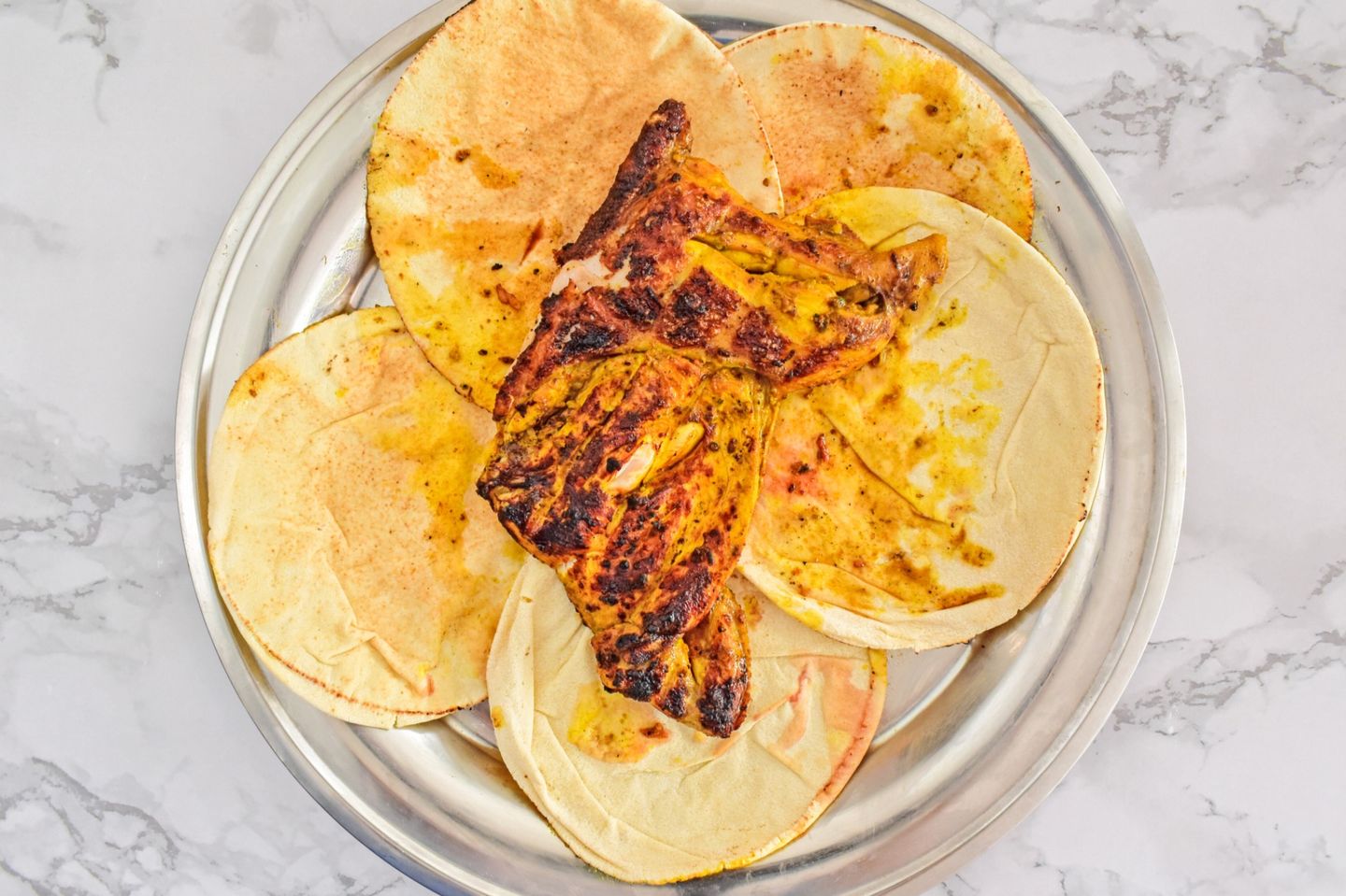 Half A Piece Of Plain Chicken On Charcoal