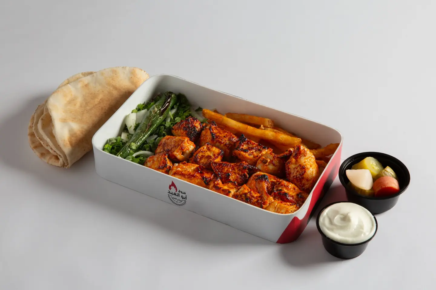 Box Of Shish Tawook Garlic Salad Bread Potatoes And Pickles