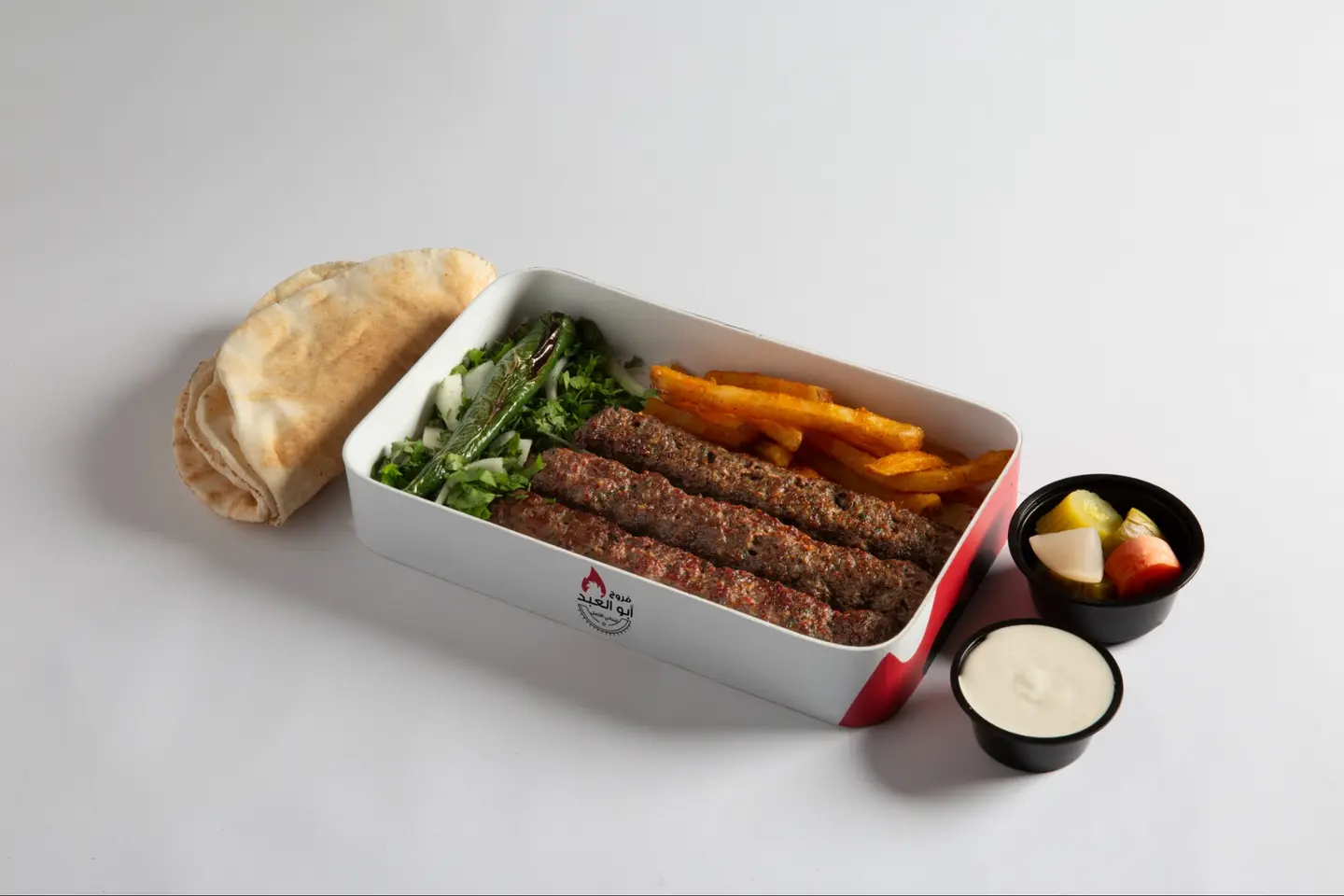 Box Of Kebab Meat Garlic Salad Bread Potatoes Pickles