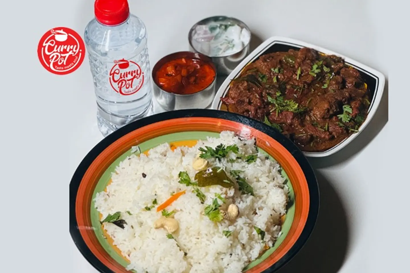 Ghee Rice + Beef Roast + Pickle + Raitha + Water