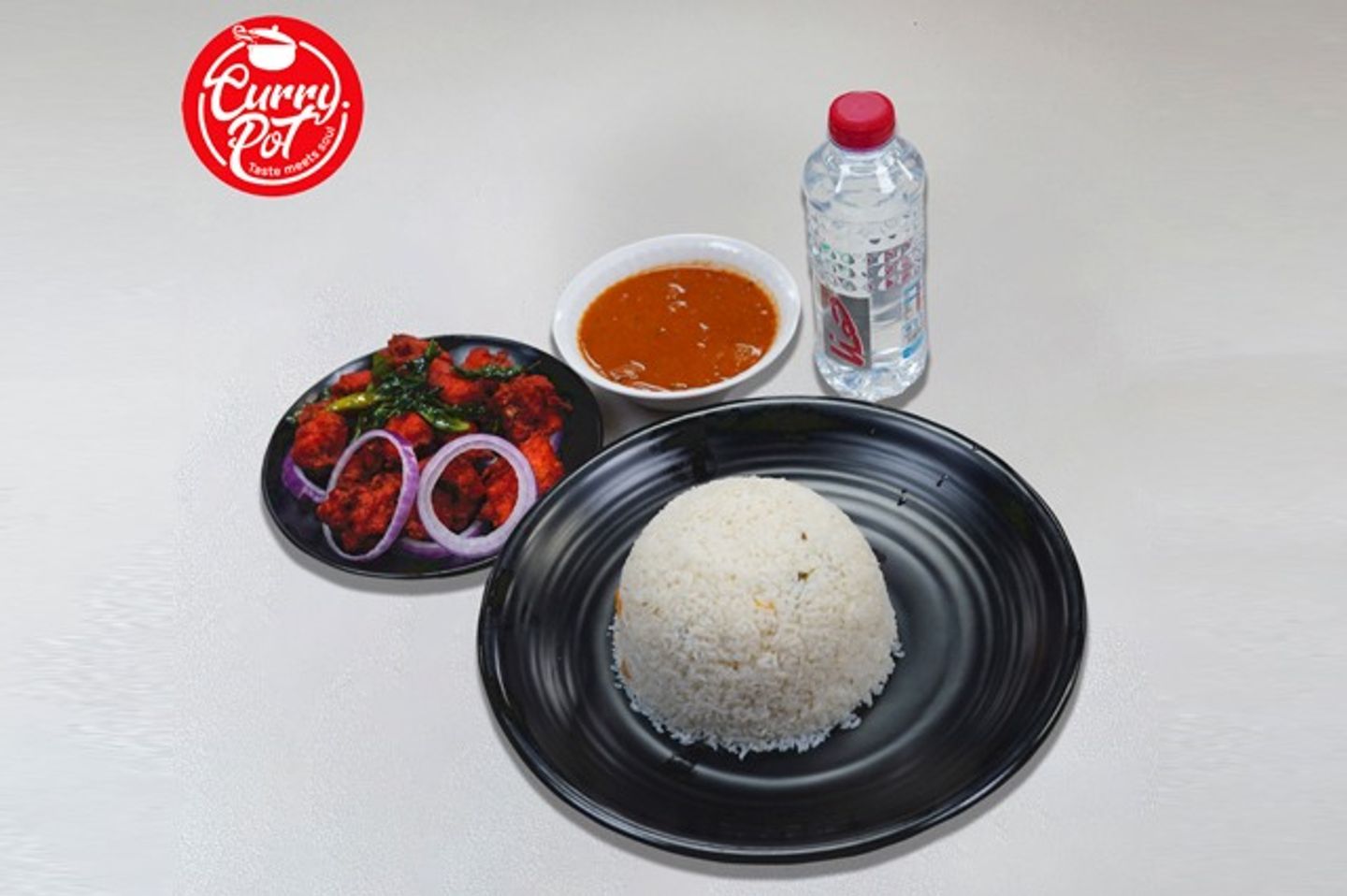 رز بالسمن + دجاج ٦٥ + مياه