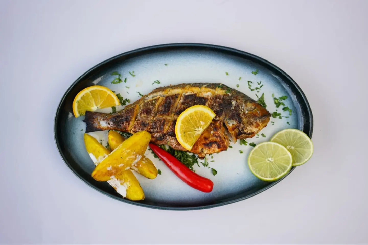 Grilled Sea Bass Dish With Oil And Lemon