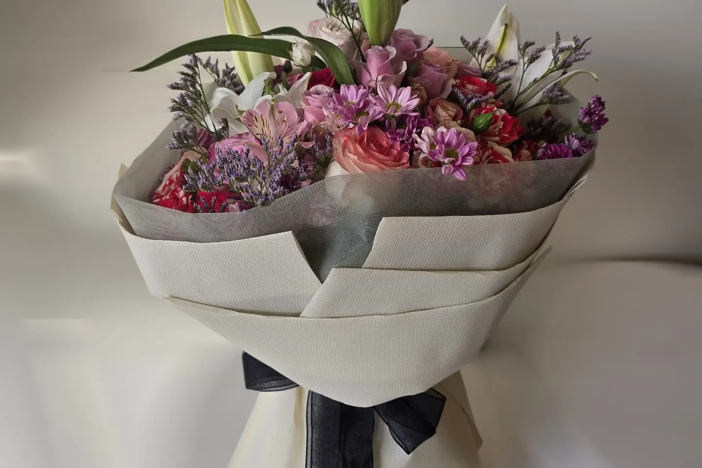A Mixed Bouquet With Beige Wrapping