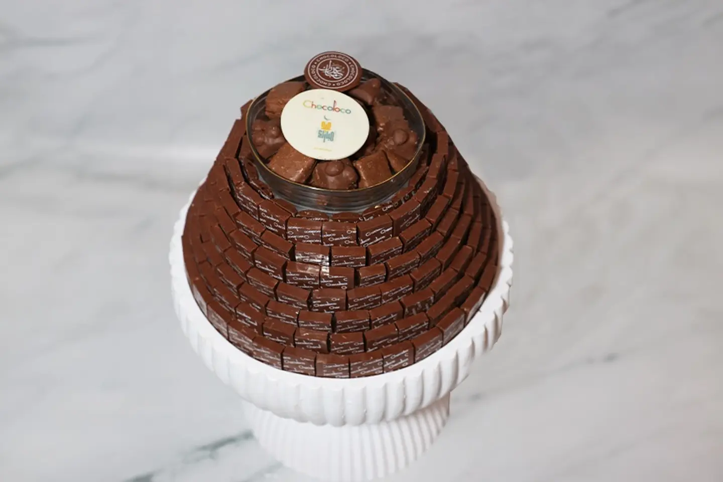 A Tray With A Base Large Size Containing Pyramid Shaped Chocolates