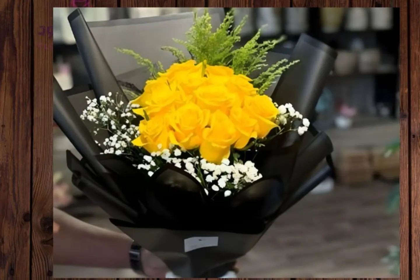 باقة ورد أصفر جوري غلاف اسود